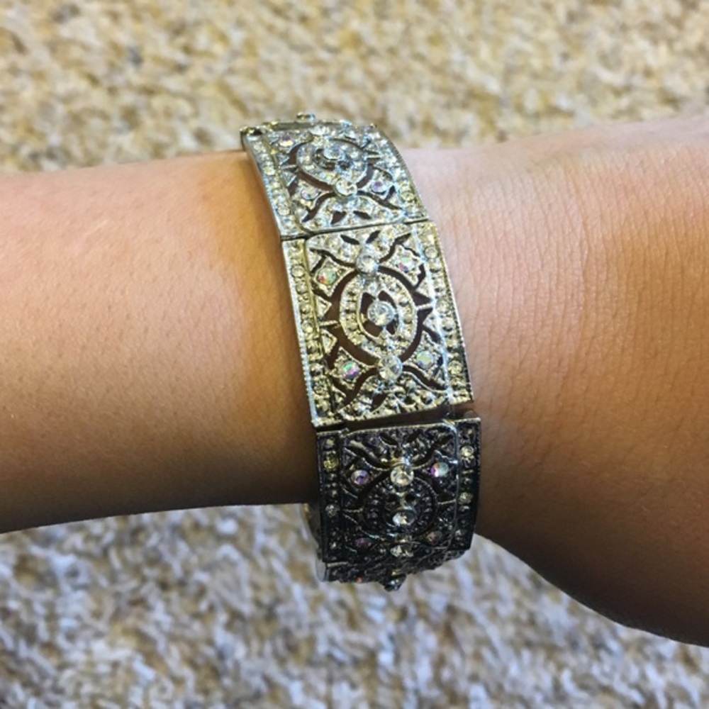 Silver colored bracelet with rhinestones.